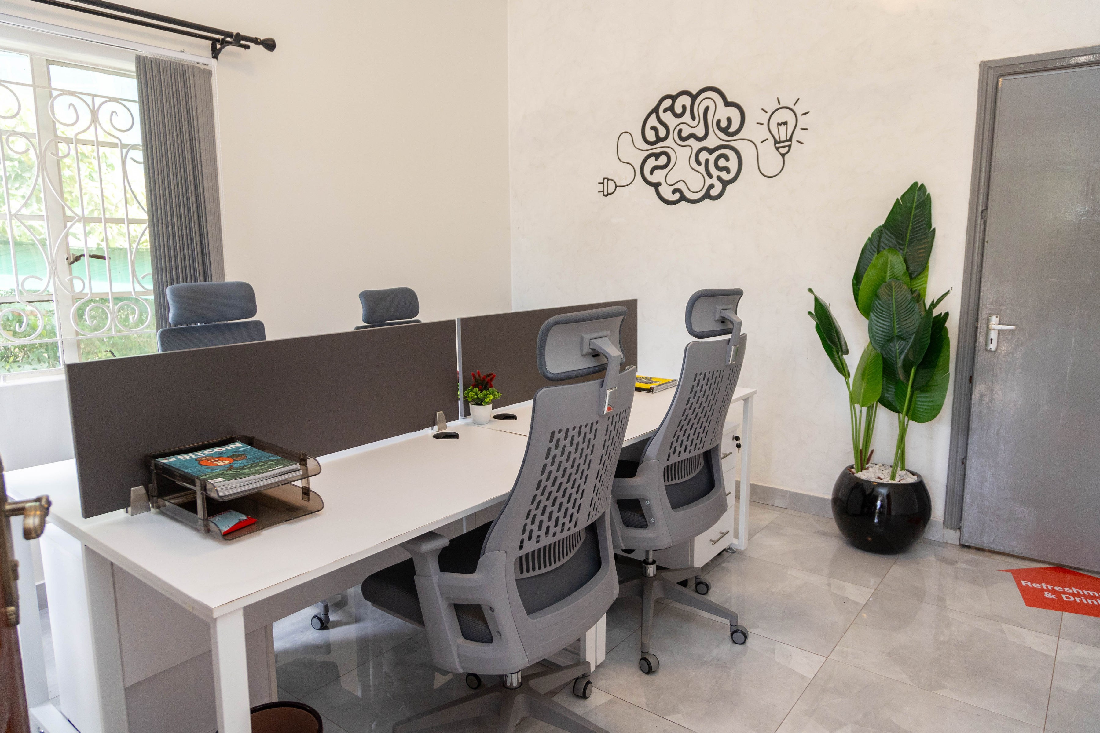 Desks in the meeting and training room at Dada Hub